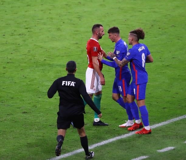 Dániel Gazdag of Hungary confronts Mason Mount and Kalvin Phillips of England during the 2022 FIFA World Cup Qualifiers match at Stadium Puskas...