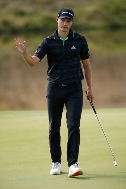 Rasmus Højgaard of Denmark acknowledges the crowd after his birdie on the 18th hole during Day Two of The Italian Open at Marco Simone Golf Club on...