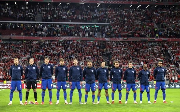 Players of England stand for the national anthem prior to the 2022 FIFA World Cup Qualifier match between Hungary and England at Stadium Puskas...