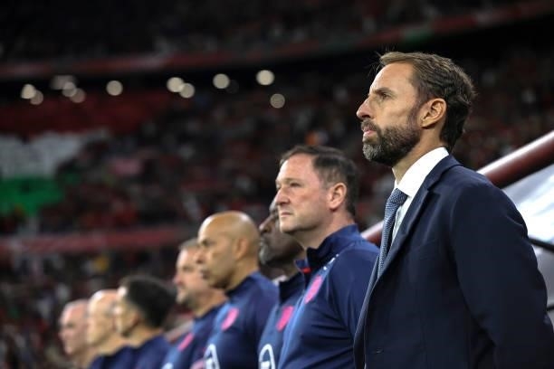 Gareth Southgate, Head Coach of England and coaching staff look on prior to the 2022 FIFA World Cup Qualifier match between Hungary and England at...