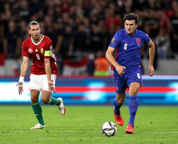Harry Maguire of England runs with the ball during the 2022 FIFA World Cup Qualifier match between Hungary and England at Stadium Puskas Ferenc on...