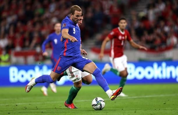 Harry Kane of England shoots during the 2022 FIFA World Cup Qualifier match between Hungary and England at Stadium Puskas Ferenc on September 02,...