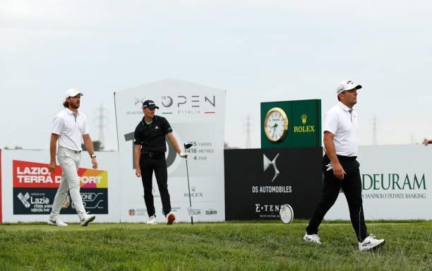 Tommy Fleetwood of England, Rasmus Højgaard of Denmark and Francesco Molinari of Italy walk off the 10th tee during Day Two of The Italian Open at...
