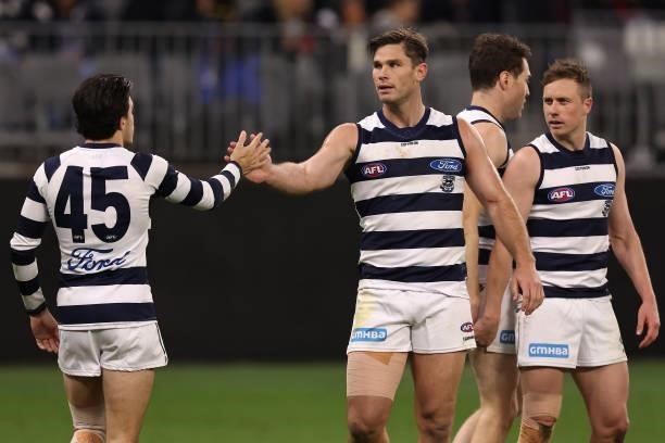 Tom Hawkins of the Cats is congratulated by team mates after kicking a goal during the AFL First Elimination Final match between Geelong Cats and...