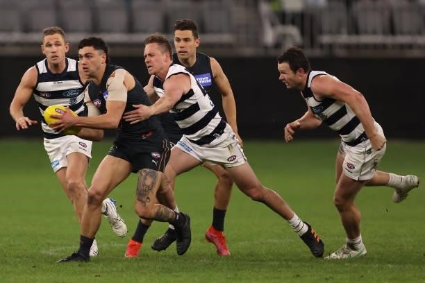 Tim Taranto of the Giants is tackled by Mitch Duncan of the Cats during the AFL First Elimination Final match between Geelong Cats and Greater...