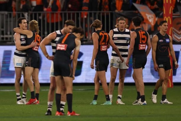 Jeremy Cameron of the Cats hugs Nick Haynes of the Giants after winning the AFL First Elimination Final match between Geelong Cats and Greater...
