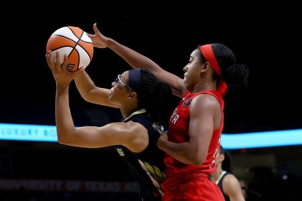 Guard Allisha Gray of the Dallas Wings drives to the basket against forward Monique Billings of the Atlanta Dream in the second half at College Park...