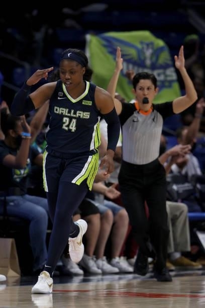 Guard Arike Ogunbowale of the Dallas Wings reacts after scoring against the Atlanta Dream in the first half at College Park Center on September 02,...