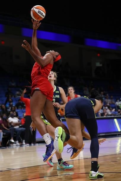 Forward Monique Billings of the Atlanta Dream drives to the basket against forward Isabelle Harrison of the Dallas Wings in the first half at College...