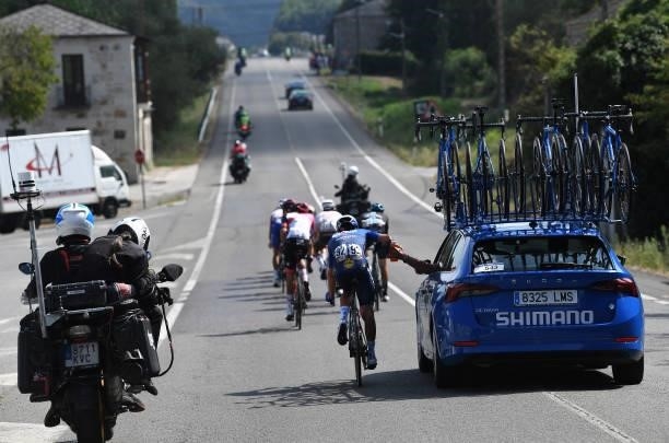 Andrea Bagioli of Italy and Team Deceuninck - Quick-Step is assisted by the technical support team during the 76th Tour of Spain 2021, Stage 19 a...