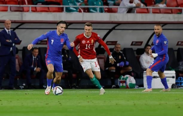 Jack Grealish of England and Bendeguz Bolla of Hungary battle for the ball next to Luke Shaw of England during the 2022 FIFA World Cup Qualifier...