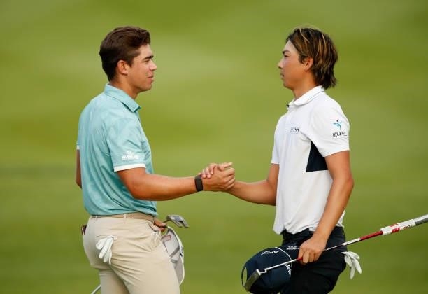 Garrick Higgo of South Africa and Min Woo Lee of Australia shake hands on the 18th hole during Day Two of The Italian Open at Marco Simone Golf Club...