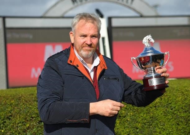 Trainer Cliff Brown poses with trophy after The Inferno won race 5, the Mitty's Mcewen Stakes, during Melbourne Racing at Moonee Valley Racecourse on...