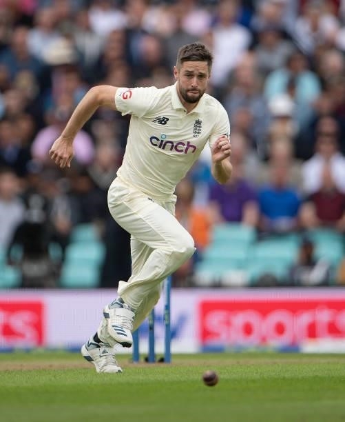 Chris Woakes of England fields off his own bowling during the Fourth LV= Insurance Test Match: Day One between England and India at The Kia Oval on...
