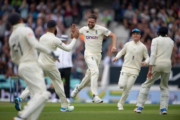 Chris Woakes of England celebrates taking the wicket of Rohit Sharma of India during the Fourth LV= Insurance Test Match: Day One between England and...
