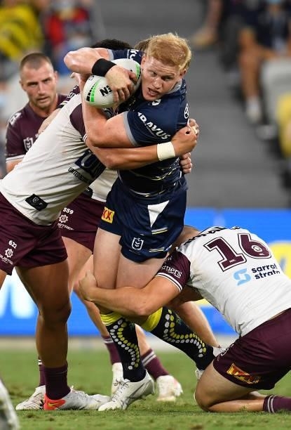 Griffin Neame of the Cowboys is tackled during the round 25 NRL match between the North Queensland Cowboys and the Manly Sea Eagles at QCB Stadium,...