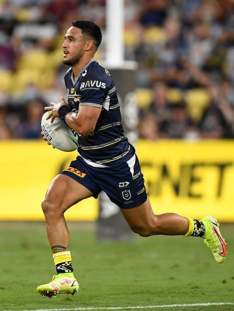 Valentine Holmes of the Cowboys runs the ball during the round 25 NRL match between the North Queensland Cowboys and the Manly Sea Eagles at QCB...
