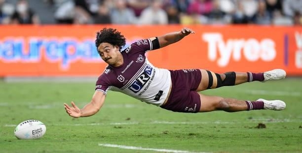 Morgan Harper of the Sea Eagles attempts to gather the ball during the round 25 NRL match between the North Queensland Cowboys and the Manly Sea...