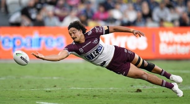 Morgan Harper of the Sea Eagles attempts to gather the ball during the round 25 NRL match between the North Queensland Cowboys and the Manly Sea...