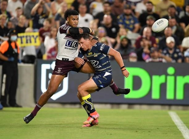 Haumole Olakau'atu of the Sea Eagles knocks the ball so Jake Trbojevic can score a try during the round 25 NRL match between the North Queensland...