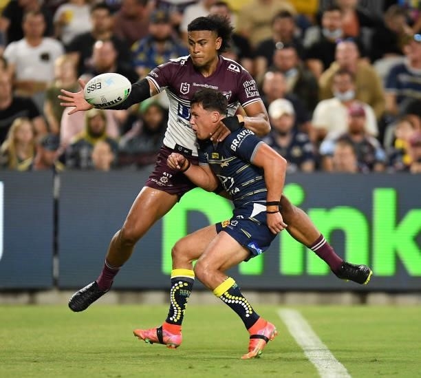 Haumole Olakau'atu of the Sea Eagles knocks the ball so Jake Trbojevic can score a try during the round 25 NRL match between the North Queensland...