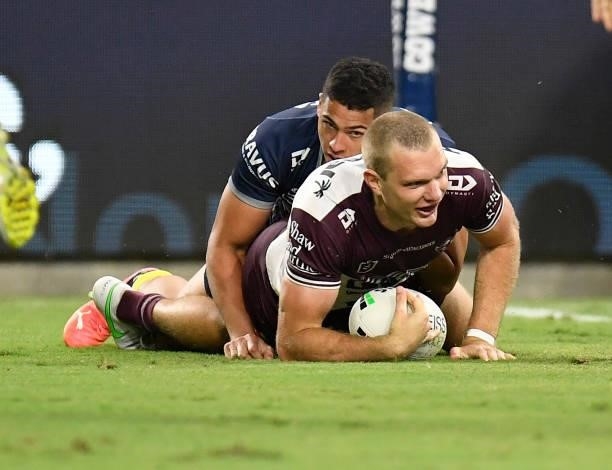 Tom Trbojevic of the Sea Eagles scores a try during the round 25 NRL match between the North Queensland Cowboys and the Manly Sea Eagles at QCB...