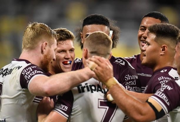 The Sea Eagles celebrate after winning the round 25 NRL match between the North Queensland Cowboys and the Manly Sea Eagles at QCB Stadium, on...