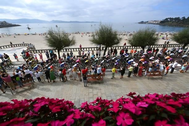 General view of the peloton passing through Sanxenxo village at start during the 76th Tour of Spain 2021, Stage 20 a 202,2km km stage from Sanxenxo...