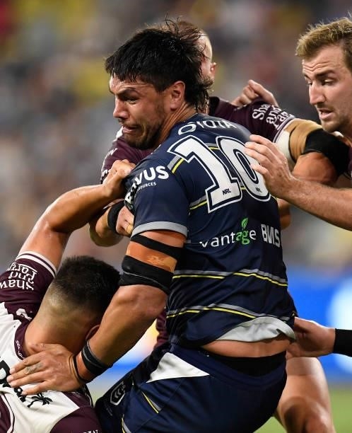 Jordan McLean of the Cowboys is tackled during the round 25 NRL match between the North Queensland Cowboys and the Manly Sea Eagles at QCB Stadium,...