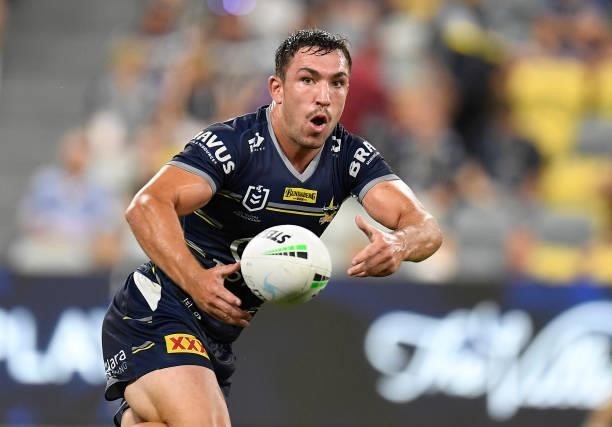 Reece Robson of the Cowboys passes the ball during the round 25 NRL match between the North Queensland Cowboys and the Manly Sea Eagles at QCB...