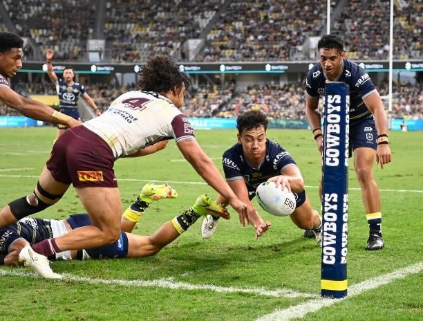 Daejarn Asi of the Cowboys dives for the try line during the round 25 NRL match between the North Queensland Cowboys and the Manly Sea Eagles at QCB...