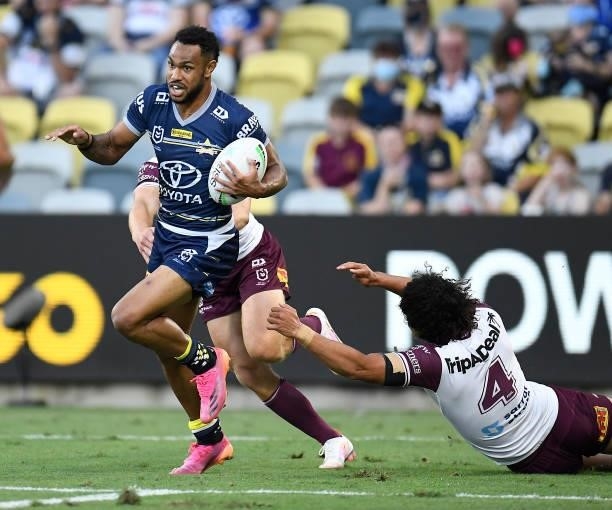 Hamiso Tabuai-Fidow of the Cowboys makes a break during the round 25 NRL match between the North Queensland Cowboys and the Manly Sea Eagles at QCB...