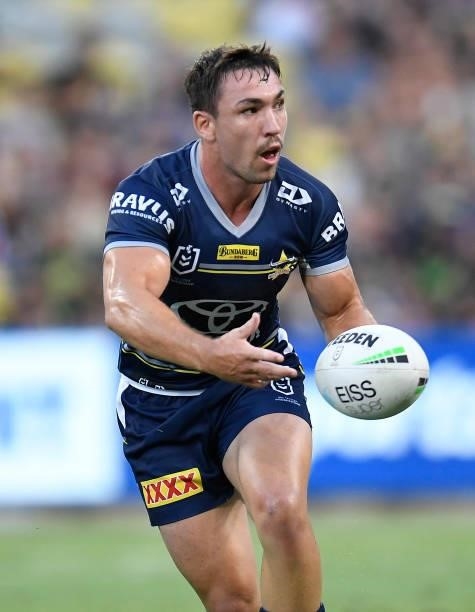 Reece Robson of the Cowboys passes the ball during the round 25 NRL match between the North Queensland Cowboys and the Manly Sea Eagles at QCB...