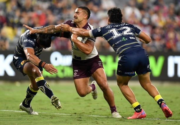 Dylan Walker of the Sea Eagles is tackled during the round 25 NRL match between the North Queensland Cowboys and the Manly Sea Eagles at QCB Stadium,...