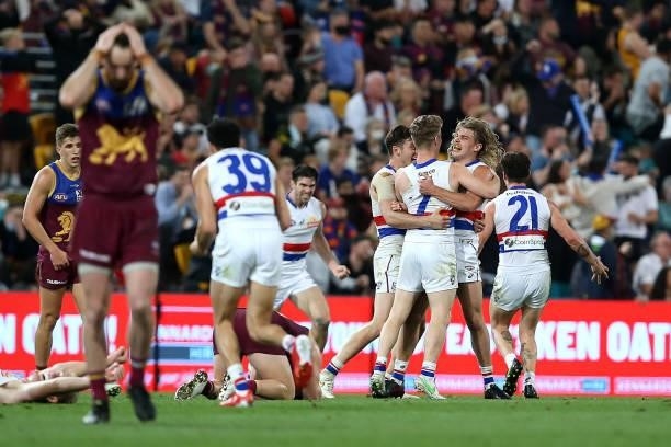 The Bulldogs celebrate winning the AFL 1st Semi Final match between Brisbane Lions and the Western Bulldogs at The Gabba on September 04, 2021 in...
