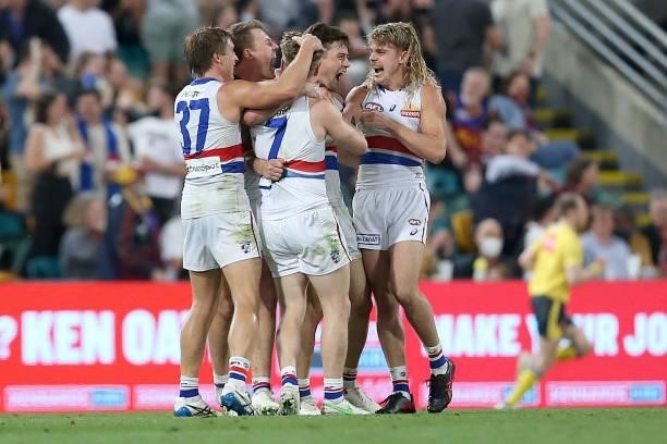 The Bulldogs celebrate winning the AFL 1st Semi Final match between Brisbane Lions and the Western Bulldogs at The Gabba on September 04, 2021 in...