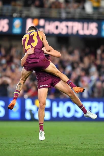 Zac Bailey of the Lions celebrates with team mate Charlie Cameron after kicking a goal during the AFL 1st Semi Final match between the Brisbane Lions...