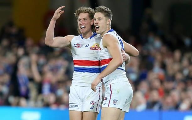 Aaron Naughton and Josh Schache of the Bulldogs celebrate a goal during the AFL 1st Semi Final match between Brisbane Lions and the Western Bulldogs...