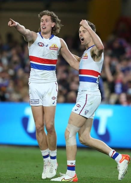 Aaron Naughton and Josh Schache of the Bulldogs celebrate a goal during the AFL 1st Semi Final match between Brisbane Lions and the Western Bulldogs...