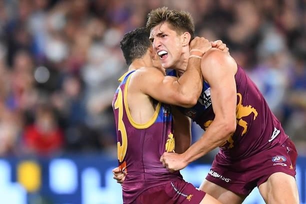 Zac Bailey of the Lions celebrates with team mate Charlie Cameron after kicking a goal during the AFL 1st Semi Final match between the Brisbane Lions...