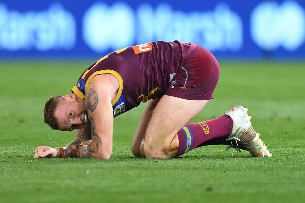 Mitch Robinson of the Lions reacts after clashing with Aaron Naughton of the Bulldogs during the AFL 1st Semi Final match between the Brisbane Lions...