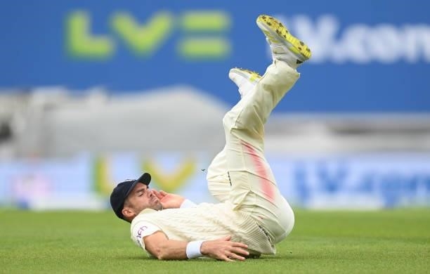 James Anderson of England stops a shot from Cheteshwar Pujara of India during the third day of the 4th LV= Test Match between England and India at...