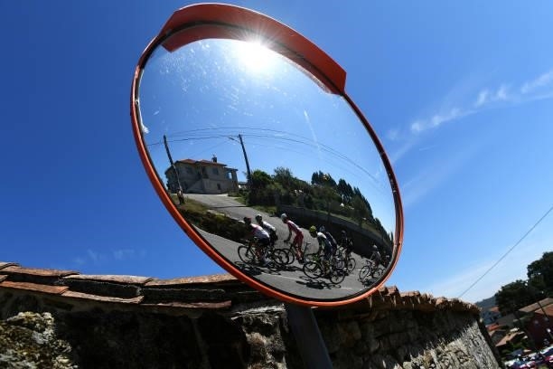 Mirror shows the reflection of Ryan Gibbons of South Africa and UAE Team Emirates, Nicholas Schultz of Australia and Team BikeExchange, Jesús Herrada...
