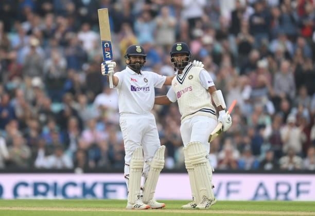 Rohit Sharma celebrates with Cheteshwar Pujara of India after reaching his century during the third day of the 4th LV= Test Match between England and...