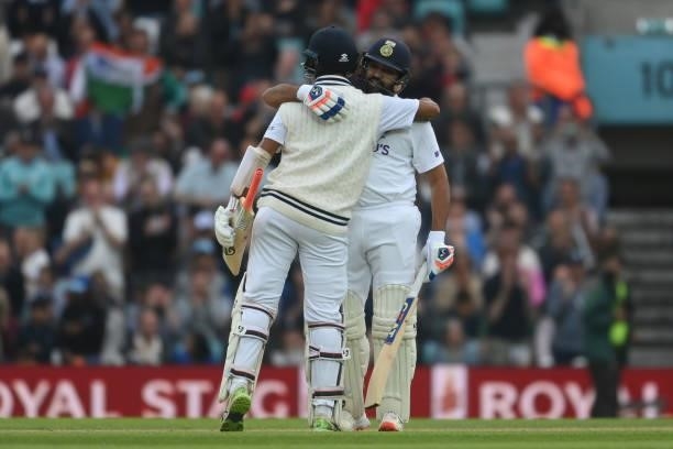 Rohit Sharma of India celebrates with Cheteshwar Pujara after reaching his century during the Fourth LV= Insurance Test Match: Day Three between...