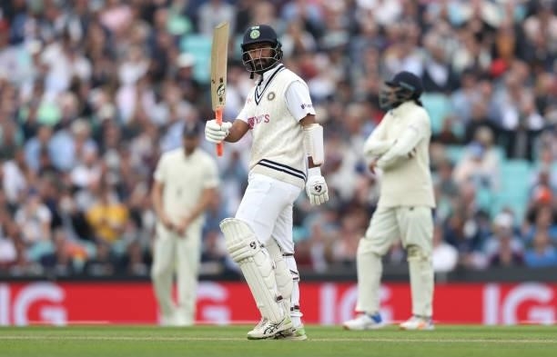 Cheteshwar Pujara of India celebrates his fifty runs during day three of the fourth LV= Insurance Test match between England and India at The Kia...