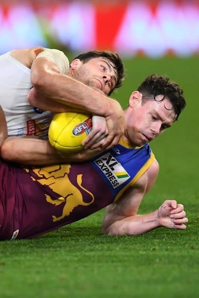 Lachie Neale of the Lions is tackled by Josh Dunkley of the Bulldogs during the AFL 1st Semi Final match between the Brisbane Lions and the Western...