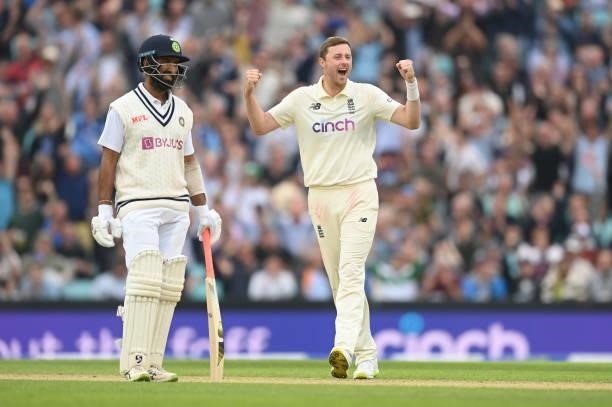 Ollie Robinson of England celebrates after dismissing Rohit Sharma as Cheteshwar Pujara of India looks on during the third day of the 4th LV= Test...