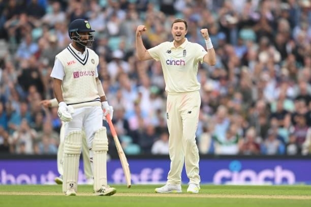 Ollie Robinson of England celebrates after dismissing Rohit Sharma as Cheteshwar Pujara of India looks on during the third day of the 4th LV= Test...