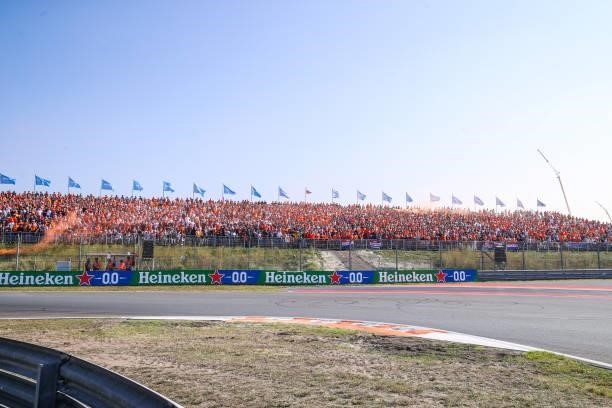 Fans and supporters in mostly orange suits watching Max Verstappen during the Qualification of F1 Grand Prix of The Netherlands at Circuit Zandvoort...